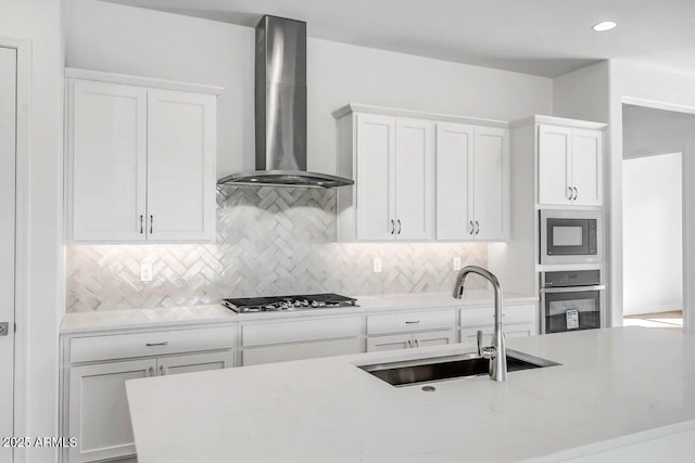 3310 Iron King Cir, Prescott, AZ 86301 - kitchen with wall chimney exhaust hood, tasteful backsplash, white cabinetry, a sink, and stainless steel appliances