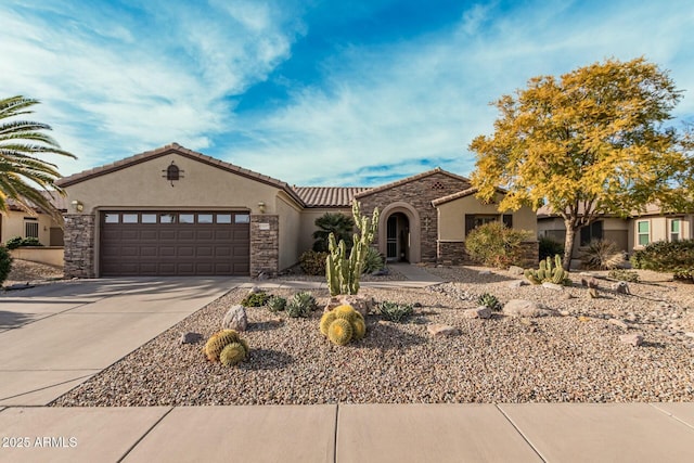 mediterranean / spanish house featuring a garage