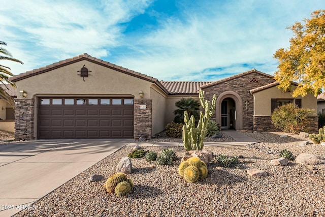 mediterranean / spanish-style home featuring a garage