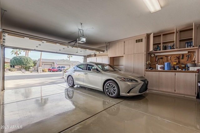 garage featuring a garage door opener