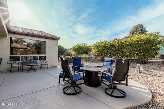 view of patio / terrace featuring an outdoor fire pit