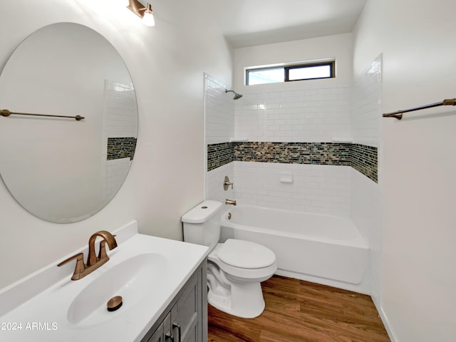 bathroom with hardwood / wood-style flooring, toilet, and vanity