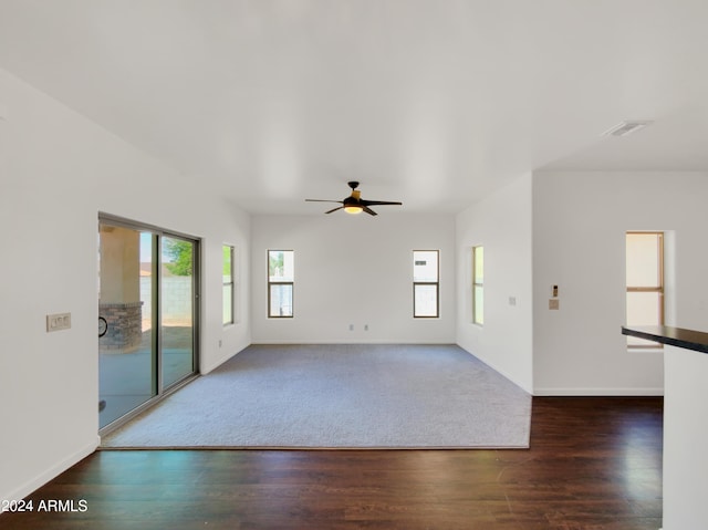 unfurnished living room with ceiling fan and hardwood / wood-style floors