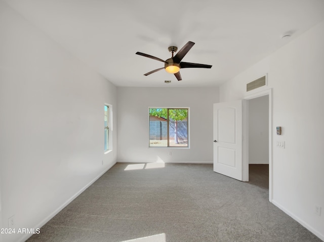 unfurnished room featuring carpet flooring and ceiling fan