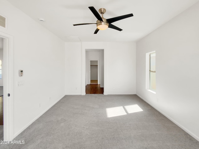 unfurnished room featuring carpet floors and ceiling fan