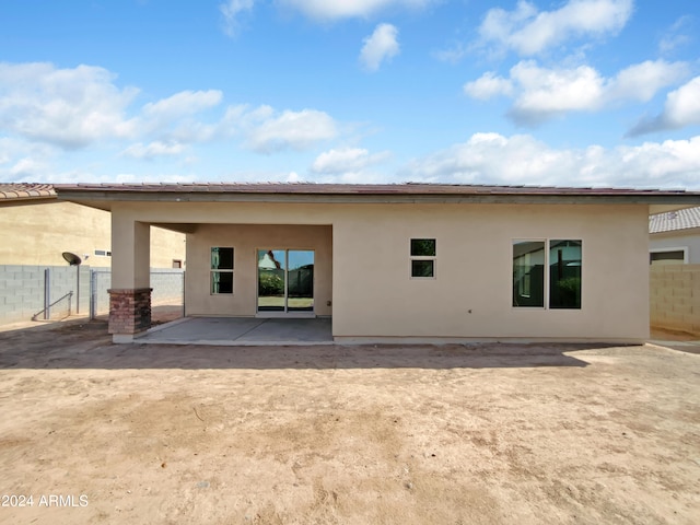 rear view of house with a patio