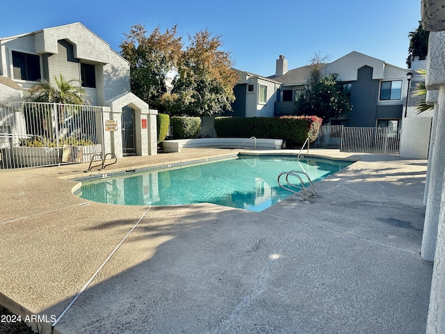 view of swimming pool with a patio area