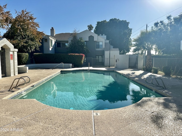 view of pool featuring a patio