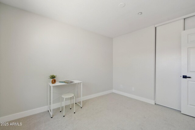 7500 E Deer Valley Rd Unit 132, Scottsdale, AZ 85255 - bedroom featuring light colored carpet, baseboards, and a closet