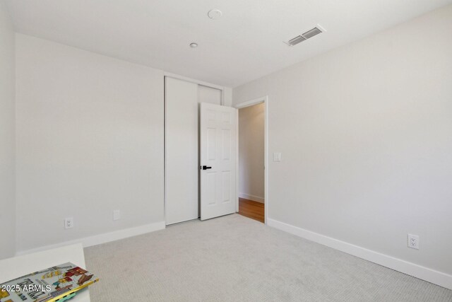 7500 E Deer Valley Rd Unit 132, Scottsdale, AZ 85255 - empty room featuring light colored carpet and baseboards