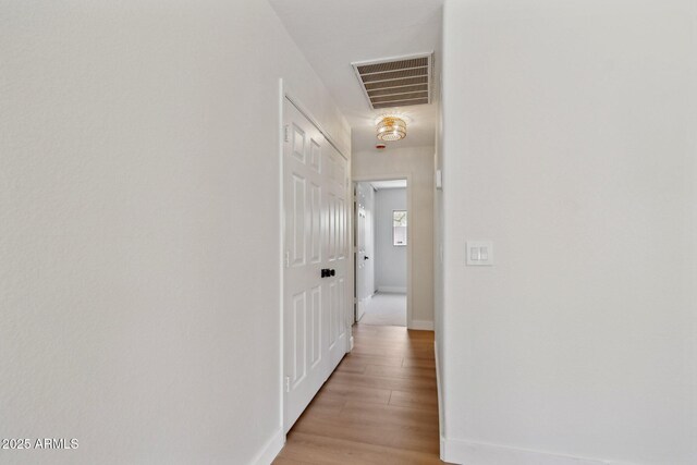 7500 E Deer Valley Rd Unit 132, Scottsdale, AZ 85255 - hallway with light wood finished floors and baseboards