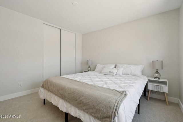 7500 E Deer Valley Rd Unit 132, Scottsdale, AZ 85255 - bedroom with light carpet, a closet, and baseboards