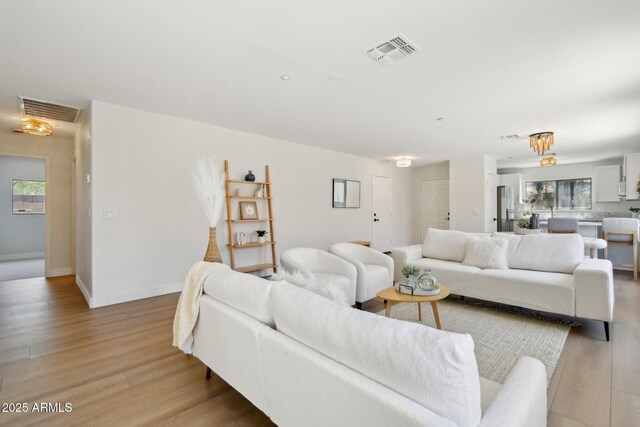7500 E Deer Valley Rd Unit 132, Scottsdale, AZ 85255 - living area featuring light wood-type flooring and baseboards