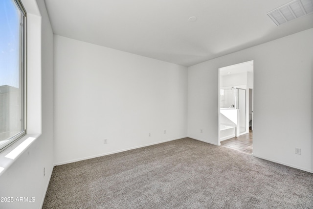 7423 W Cavalier Dr, Glendale, AZ 85303 - empty room featuring carpet flooring and baseboards
