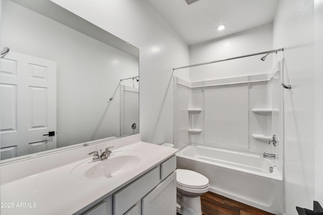 7423 W Cavalier Dr, Glendale, AZ 85303 - full bathroom featuring wood finished floors, toilet, vanity, and shower / tub combination