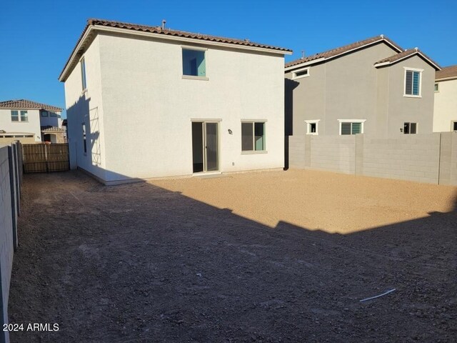 7423 W Cavalier Dr, Glendale, AZ 85303 - back of property with stucco siding, a fenced backyard, and a tiled roof