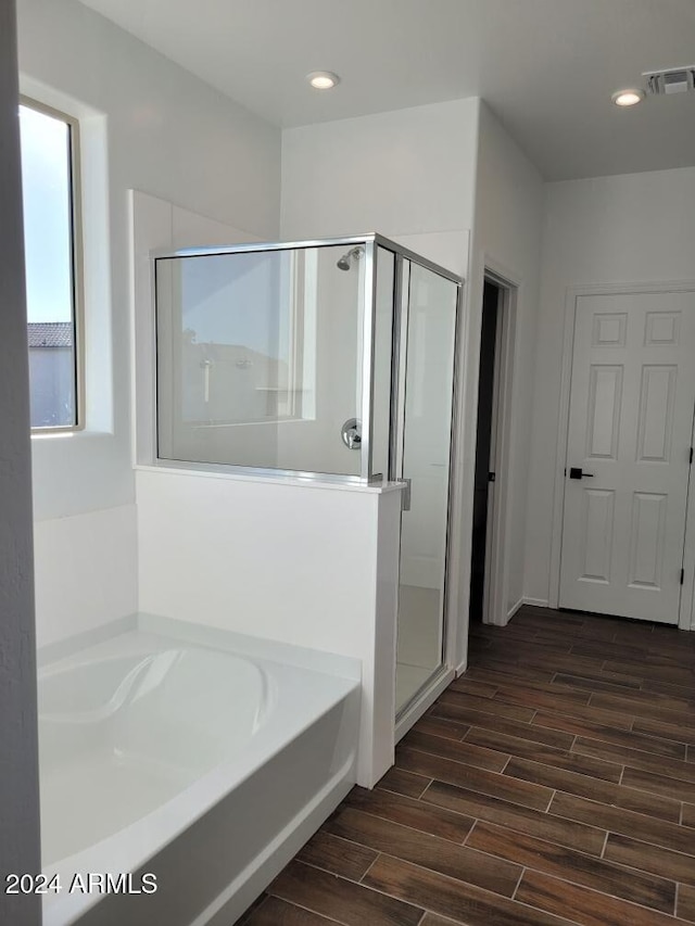 7423 W Cavalier Dr, Glendale, AZ 85303 - full bathroom with a shower stall, wood finished floors, a garden tub, and recessed lighting