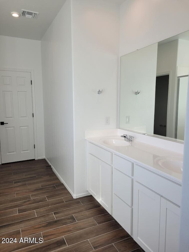 7423 W Cavalier Dr, Glendale, AZ 85303 - full bath featuring wood finished floors, double vanity, and baseboards