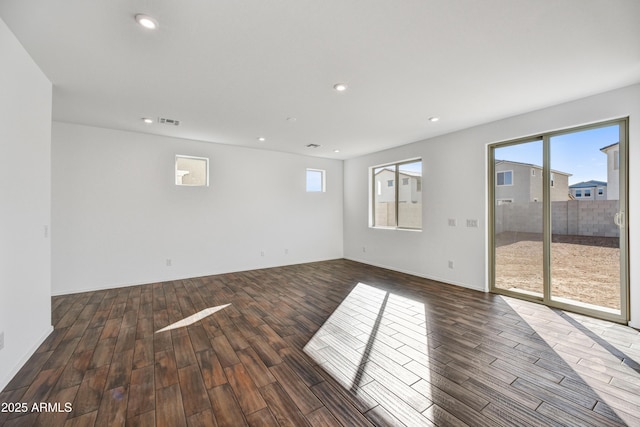7423 W Cavalier Dr, Glendale, AZ 85303 - unfurnished room with wood finished floors, recessed lighting, and baseboards