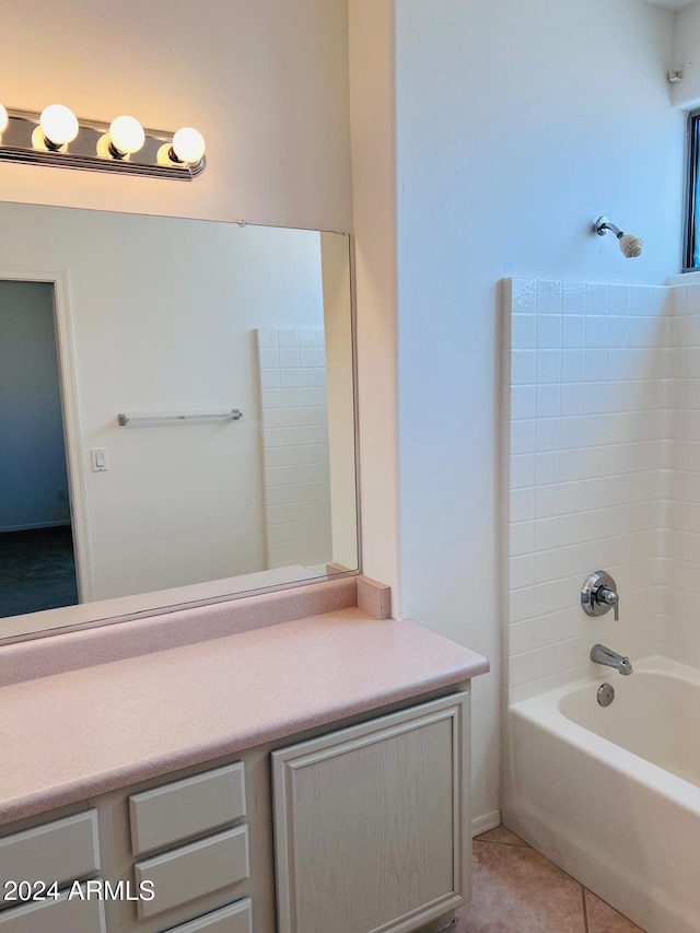 bathroom featuring vanity, tile patterned floors, and shower / bath combination