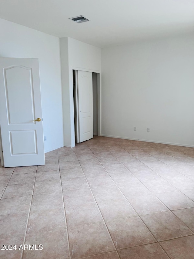 unfurnished bedroom with light tile patterned floors