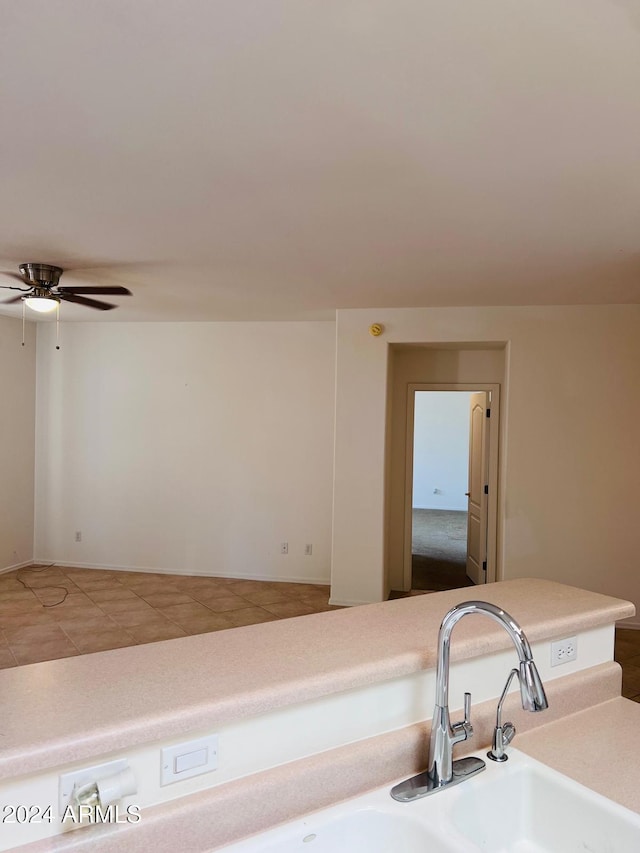 kitchen with ceiling fan and tile patterned flooring