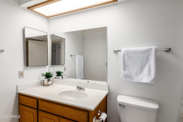 half bath with toilet and vanity