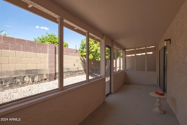 unfurnished sunroom featuring plenty of natural light