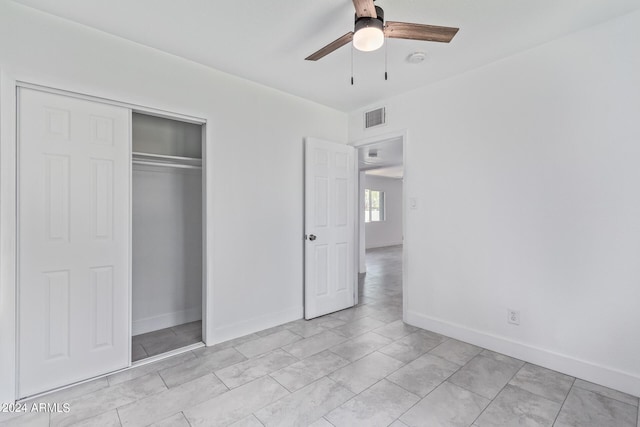 unfurnished bedroom with a closet and ceiling fan