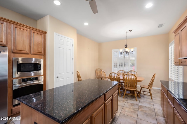 kitchen featuring recessed lighting, visible vents, an inviting chandelier, appliances with stainless steel finishes, and a kitchen island