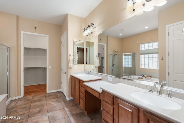 bathroom with tile patterned floors, vanity, and independent shower and bath