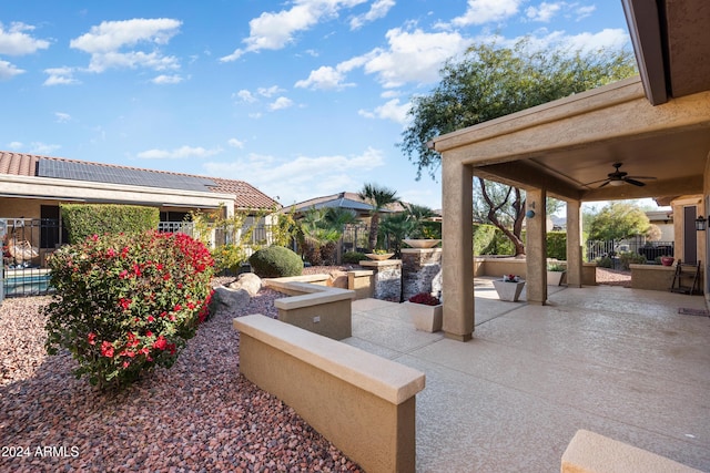 view of patio featuring ceiling fan