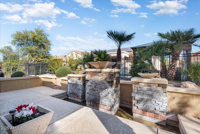 view of patio featuring fence