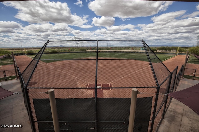 view of sport court featuring fence