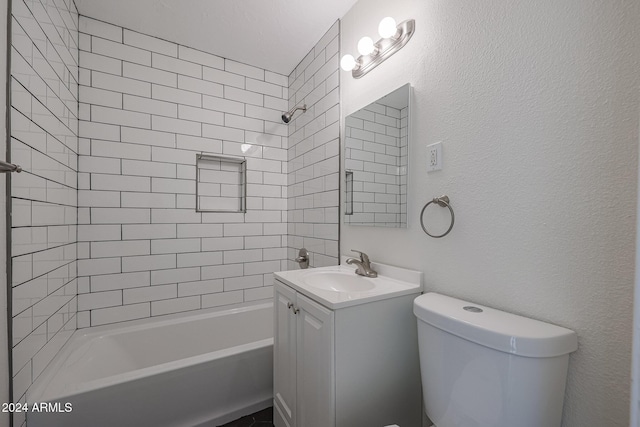 full bathroom featuring vanity, toilet, and tiled shower / bath