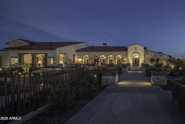18322 W Thistle Landing Dr, Goodyear, AZ 85338 - rear view of property with a chimney, fence, stucco siding, and a patio area