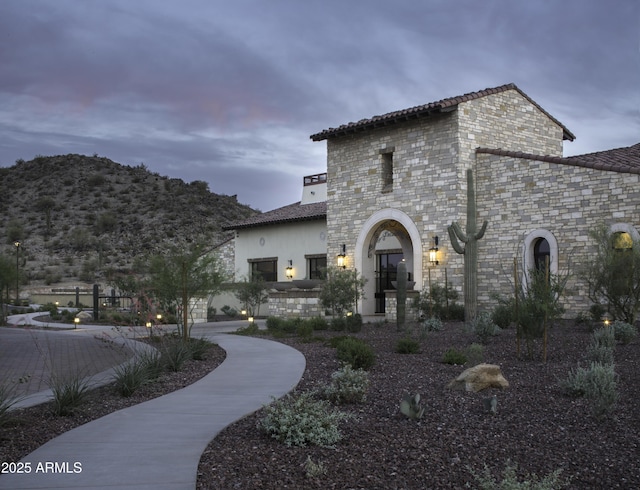 18322 W Thistle Landing Dr, Goodyear, AZ 85338 - exterior space with a mountain view and stone siding