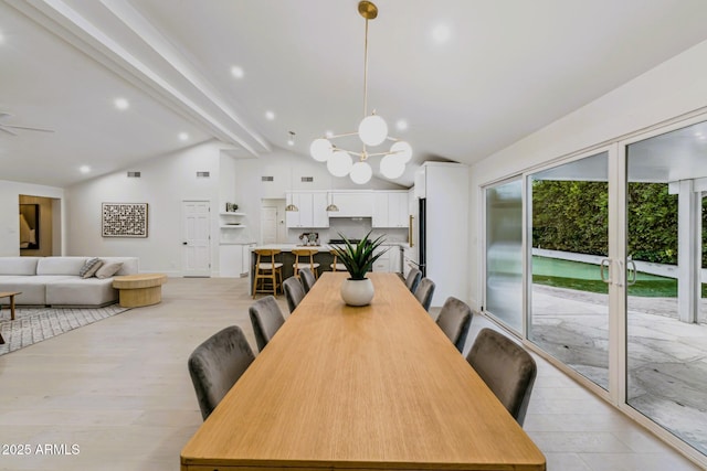 dining area with ceiling fan with notable chandelier, lofted ceiling with beams, recessed lighting, and light wood finished floors