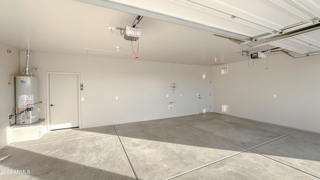 garage featuring gas water heater and a garage door opener