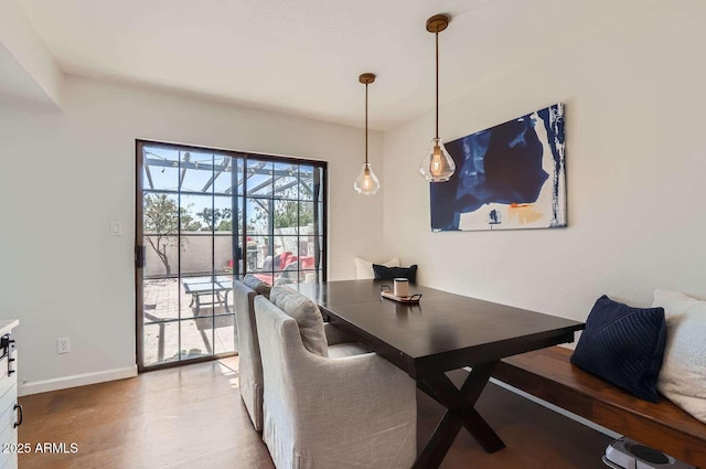 dining space featuring baseboards