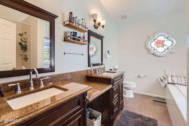 full bath featuring tile patterned flooring, visible vents, a tile shower, and vanity