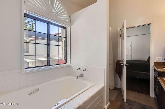 full bath featuring tile patterned flooring and a bath