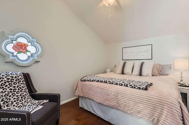 bedroom featuring lofted ceiling, dark wood-type flooring, a ceiling fan, and baseboards