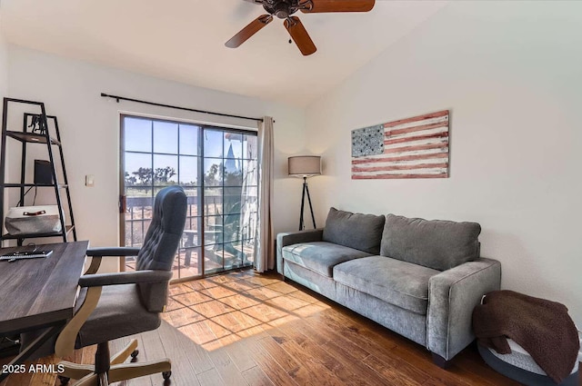 home office featuring ceiling fan, vaulted ceiling, and wood finished floors