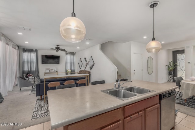 4010 W Coles Rd, Laveen, AZ 85339 - kitchen featuring stainless steel dishwasher, a sink, open floor plan, hanging light fixtures, and recessed lighting