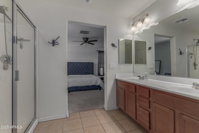 4010 W Coles Rd, Laveen, AZ 85339 - ensuite bathroom featuring a shower stall, tile patterned floors, double vanity, a ceiling fan, and baseboards