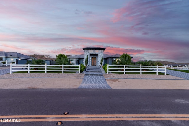 modern home featuring a fenced front yard