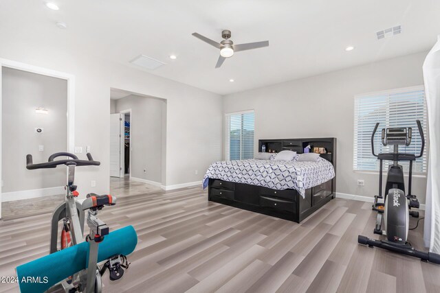 bedroom with light hardwood / wood-style flooring and ceiling fan