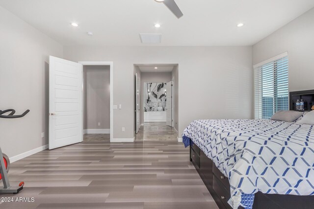 bedroom with ceiling fan and hardwood / wood-style flooring