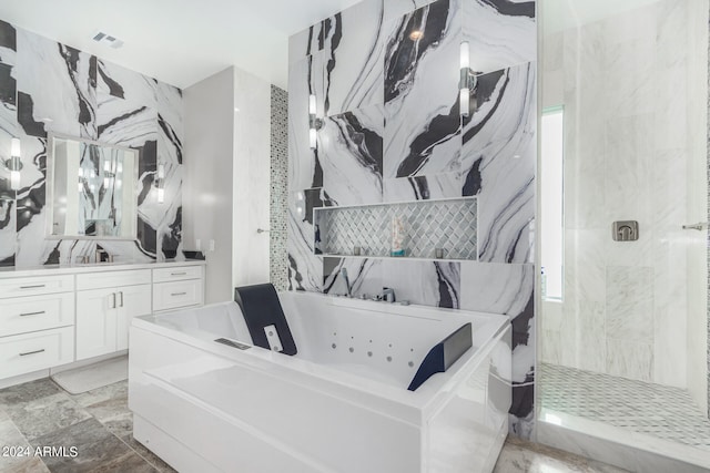 bathroom with tile patterned flooring, plus walk in shower, and vanity